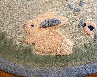 E52 - $50. Pottery Barn Kids Area Rug. Measures 60". Needs cleaned.