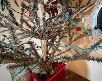 E11 - $95. Vintage Feather Tree (was stuck in the new red pot). Measures 51" tall.