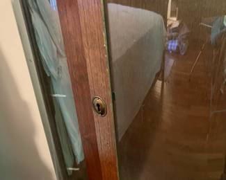 E44 - $100. Bow front curio with 3 glass shelves. Measures 34.5" wide x 14.25" deep x 57" tall.