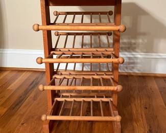 E65 - $25. Magazine Rack. Measures 18.5" x 13" x 23" tall.