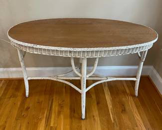 E1 - $125. Oval Wicker Wooden Top Dresser. Measures 48" x 24.5" x 30.5" tall.