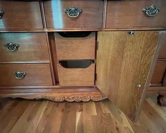 E23 - $250. Lexington Dresser with Mirror. Measures 64" x 21" x 34" tall. Mirror is 48" x 48". Pull for cabinet, bottom middle, needs a new screw.
