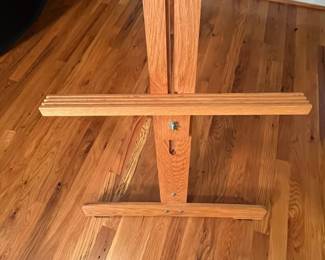 E64 - $40. Adjustable Wooden Floor Easel. Measures 24.75 x 72" tall.