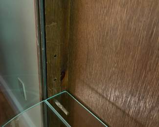 E44 - $100. Bow front curio with 3 glass shelves. Measures 34.5" wide x 14.25" deep x 57" tall.