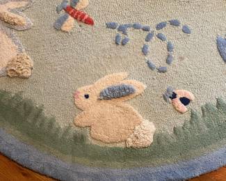 E52 - $50. Pottery Barn Kids Area Rug. Measures 60". Needs cleaned.