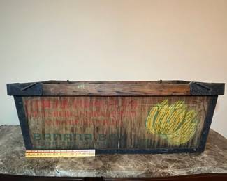 E107 - $75. Banana Crate. Measures 34.5" long x 16" wide x 13" tall.