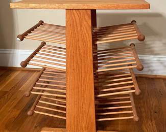 E65 - $25. Magazine Rack. Measures 18.5" x 13" x 23" tall.