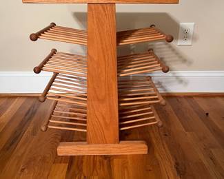 E65 - $25. Magazine Rack. Measures 18.5" x 13" x 23" tall.