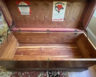 E51 - $50. Roos Cedar Chest. Measures 47" x 19" x 22.5" tall. Cedar on the inside is very nice - veneer needs some repair on the outside.