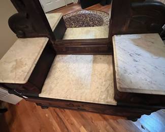 E92 - $550. Eastlake Dresser/ Vanity. Used as Entry Cabinet. Measures 50" wide x 20" deep x 98" tall. This is right inside the front door but you need to plan for help to move. Veneer is peeling but actually looks intentional in person.