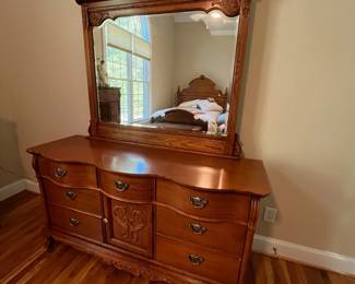 E23 - $250. Lexington Dresser with Mirror. Measures 64" x 21" x 34" tall. Mirror is 48" x 48". Pull for cabinet, bottom middle, needs a new screw.
