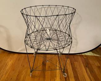 E14 - $75. Vintage Wire Laundry Basket - Black.