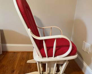 E57 - $40. White glider rocker. Has one small hole in cushion. Measures 21" wide x 40" tall.