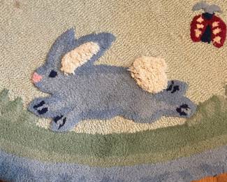 E52 - $50. Pottery Barn Kids Area Rug. Measures 60". Needs cleaned.