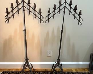 E113 - $200 PAIR of tall iron Candelabras. Adjustable Height. Measures 22.75" wide x 56" tall.
