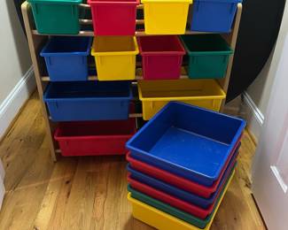 E69 - $30. Toy Sorter with Plastic Baskets. Measures 33.75" x 11.5" deep x 31" tall.