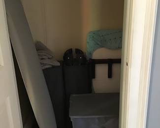 Assorted bedding, ironing board