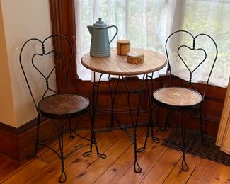 Heart shaped bistro chairs and table, vintage tea kettle.