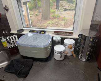 food dehydrator, canisters, knives, spice rack