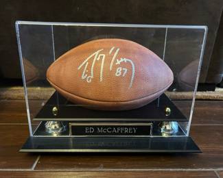 Certificate of authenticity with signed football.
