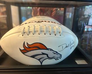 Certificate of authenticity with signed football.