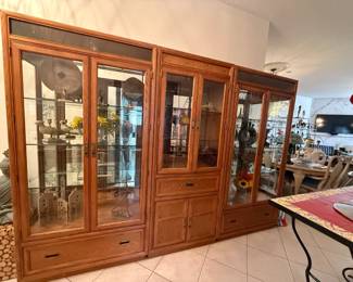 4 piece oak and glass display cabinets. Can be purchased individually, in pairs, or as a 4-unit set (3 shown here; the 4th is in another room and is the same as the center unit)