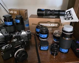 Vintage camera lens and cameras.