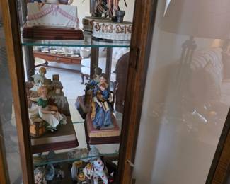 Curio filled with Norman Rockwell Music Boxes.