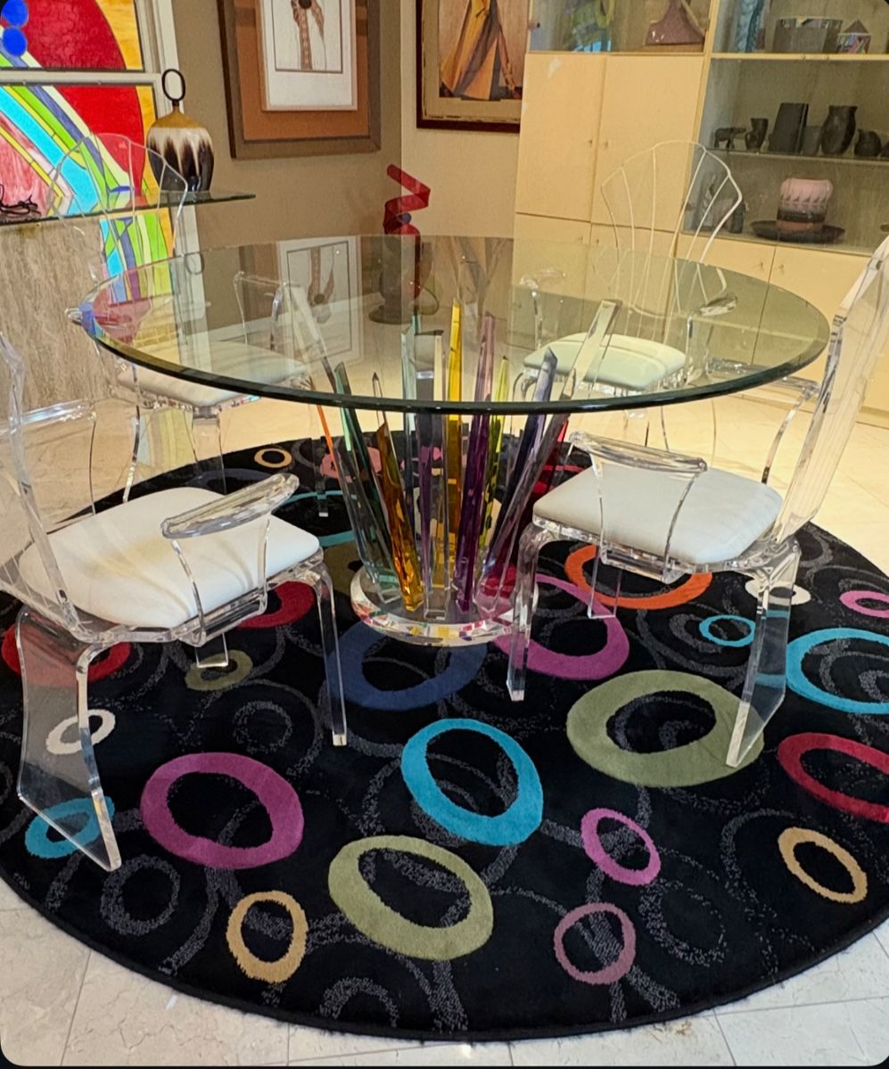 This is a Shahrooz Art "Crystals" dining table with a glass top and  Lucite base (singed)
Shlomi Haziza
And Colorful Rug