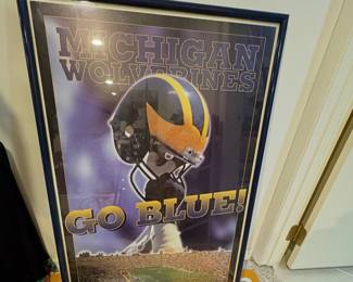 Framed poster for the Michigan Wolverines football team.