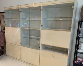 modular wall unit with glass display cases and closed cabinets.