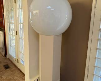 vintage modernist globe table lamp with an enameled metal canister base. (MCM)