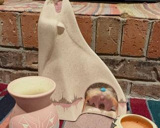 Vintage "Mother and Children" sculpture by Cantu, a Comanche artist.
Sioux pottery small vase
Pottery Candle holder