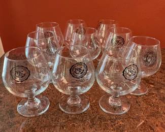 brandy snifter glasses with an etched logo for the "National Junior College Athletic Association" (NJCAA).