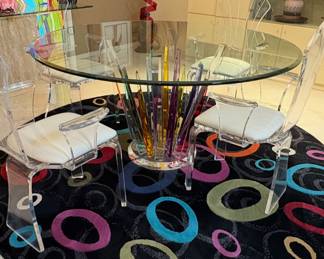 This is a Shahrooz Art "Crystals" dining table with a glass top and  Lucite base (singed)
Shlomi Haziza
And Colorful Rug