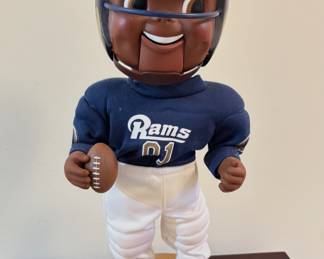 "Rockin' Randall" animatronic doll, which is an officially licensed NFL figure produced by Gemmy. The doll is wearing a St. Louis Rams uniform, which the team used while based in St. Louis from 1995-2015.