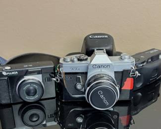 Fujica DL-20 point-and-shoot film camera.
Vintage Canon TL QL 35mm film camera with a 50mm f/1.8 FL lens.