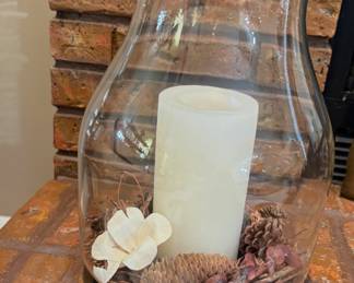 hurricane candle holder with a large pillar candle