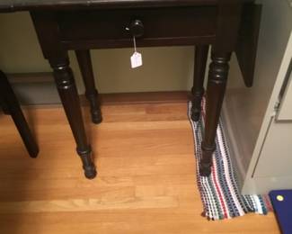 Writing desk with 1 drawer and 2 drop down sides. Desk is 19 1/2 “W with sides down and 38” W with sides up