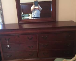 Broyhill, cherry wood. 68”L x 19”D x 36 1/4” H with 39” mirror. 2 hidden drawers
