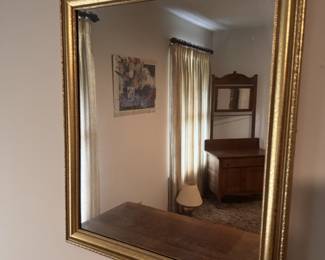 Brass-framed mirror
