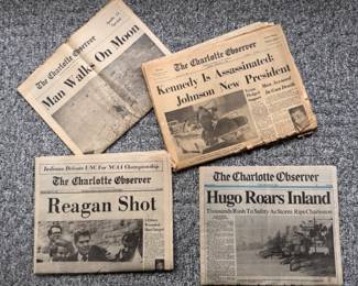 4 collectible full editions of the Charlotte Observer from: Man on the Moon, JFK Assassination, Reagan Shot, Hurricane Hugo