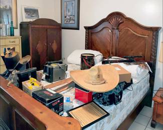 1930s Wardrobe, Queen Sized Bed, Hats, Binoculars, Military Boots. Note: There are more spats here than I have ever seen. Ever.