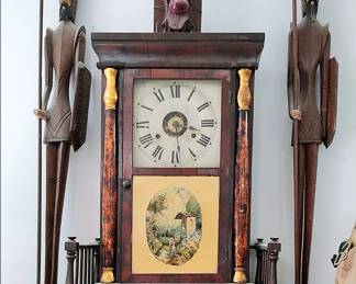 Seth Thomas Shelf Clock flanked by carved Don Quixotes.