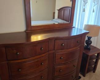 Large dresser with mirror apart of bedroom set by Broyhill
