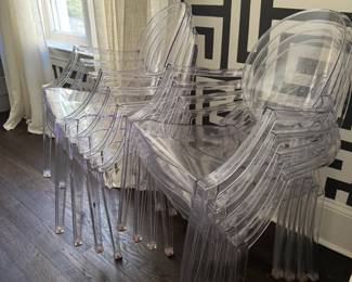 karetll chost style armed dining chairs.