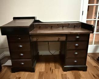 Lot #197 An Amazing Desk! 12 Drawers plus 2 Slide-outs and a standing desk with storage.