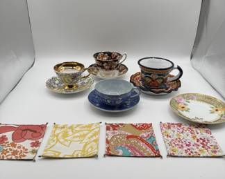 Lot #182 adorable collection of vintage tea cups with vintage style fabric, reversible coasters.