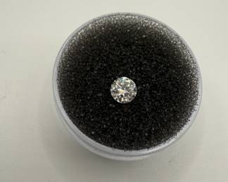 Lot #206 Diamond Collection, includes one .39 carat diamond and five small accent diamonds