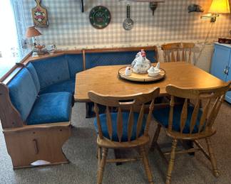 Kitchen table with bench seating that has storage